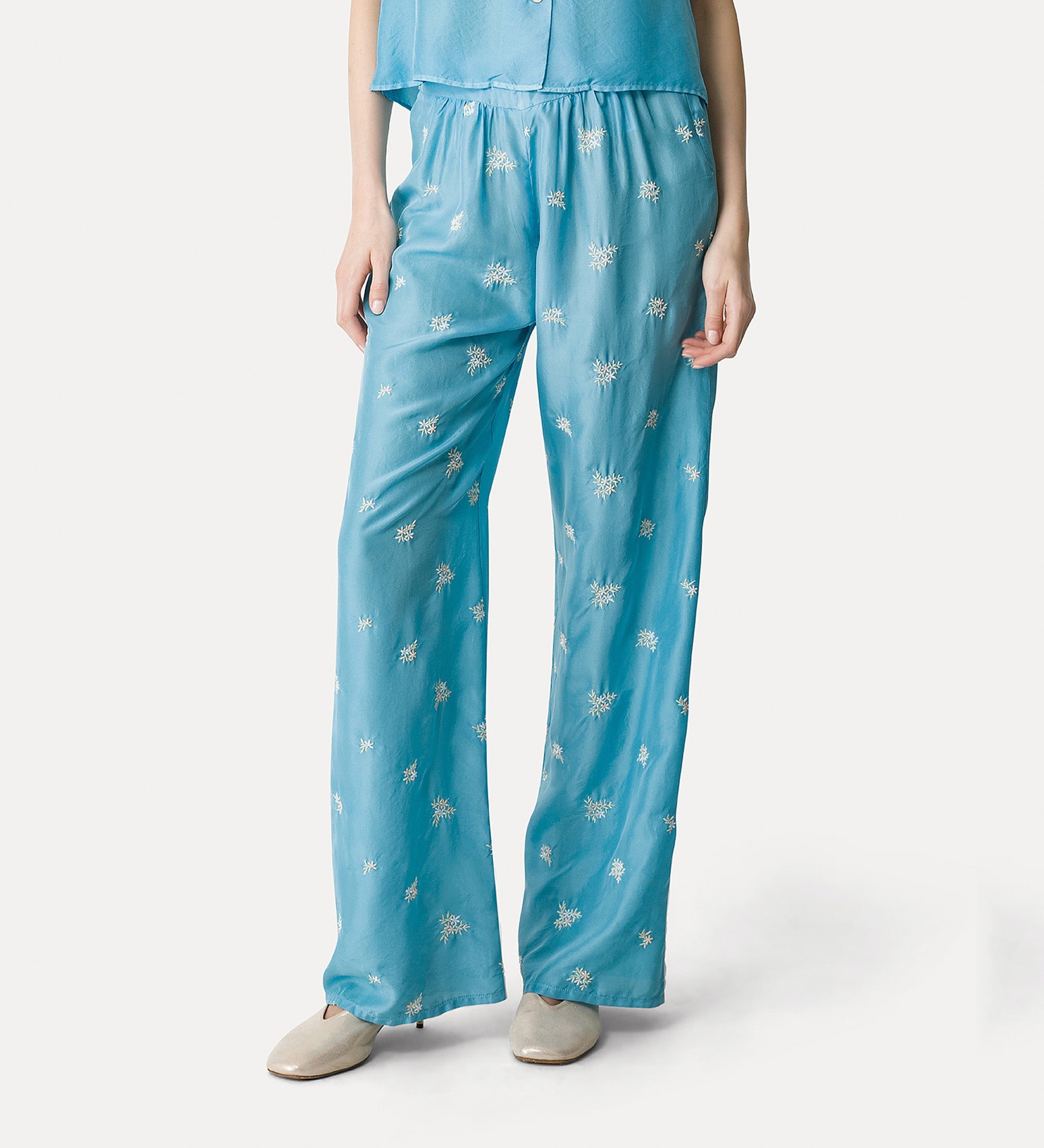 silk flared trousers with “petites fleurs” embroidery turchino