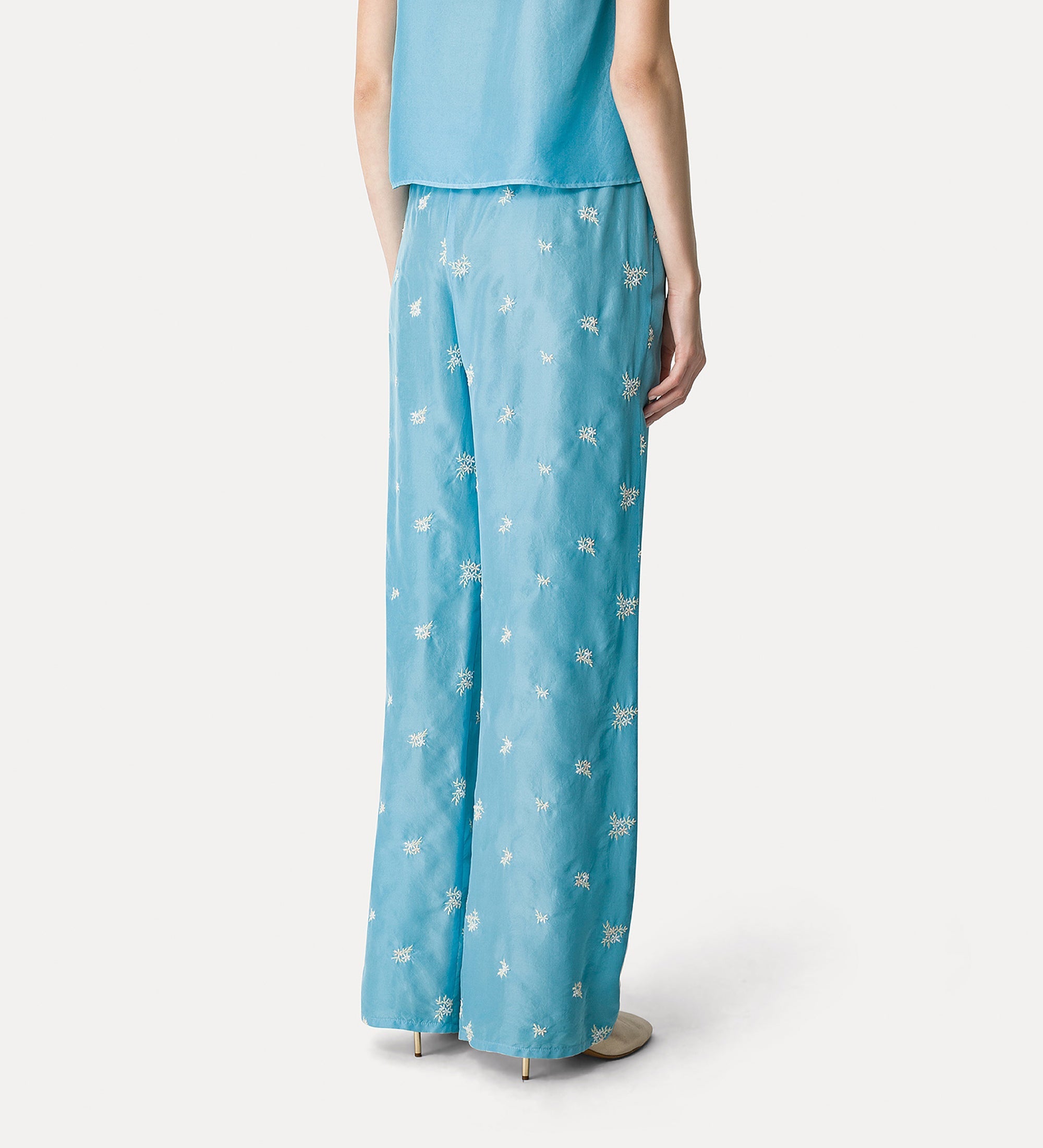 silk flared trousers with “petites fleurs” embroidery turchino