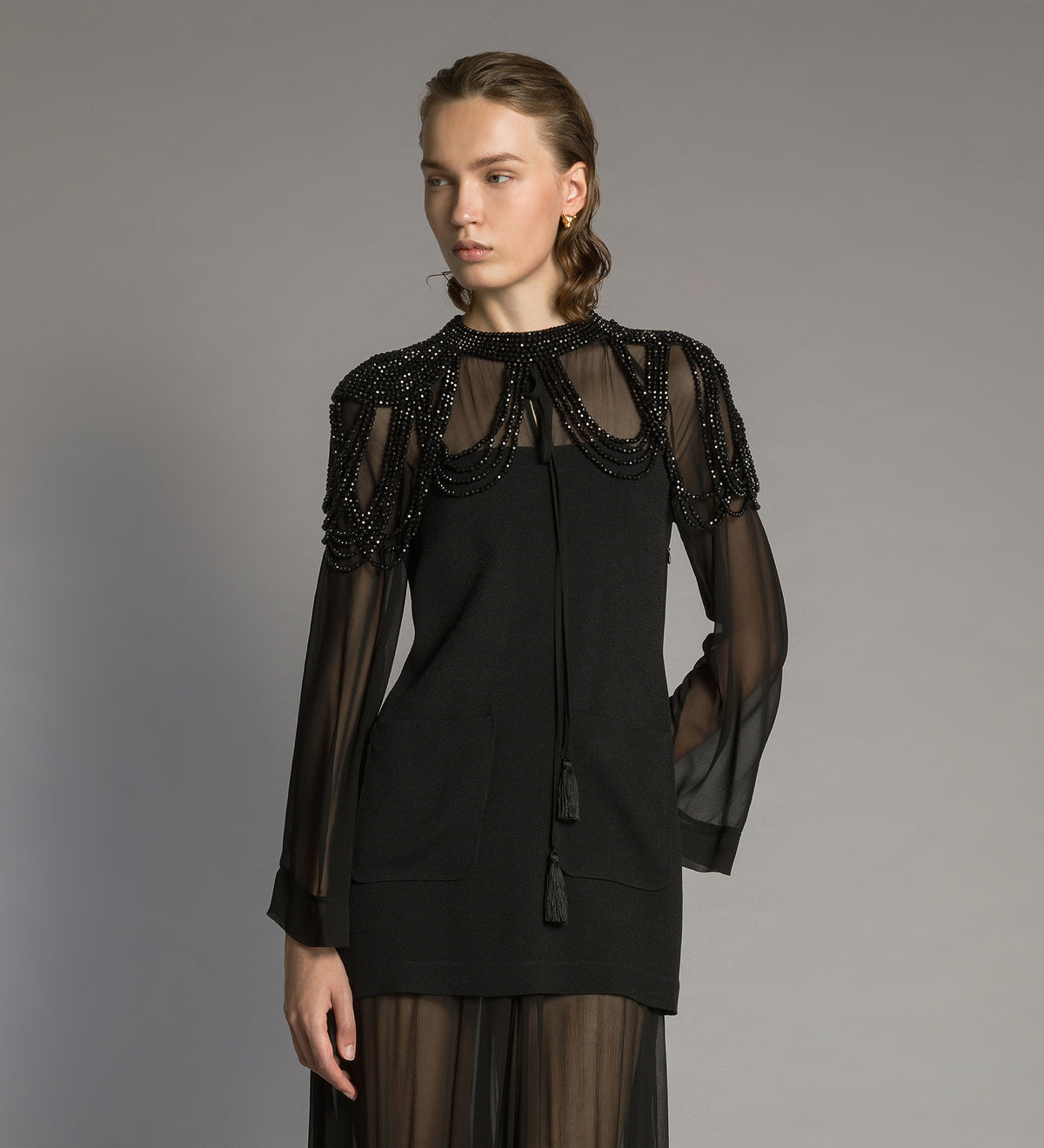 cape with hand-embroidered “black diamond” pearls black diamond