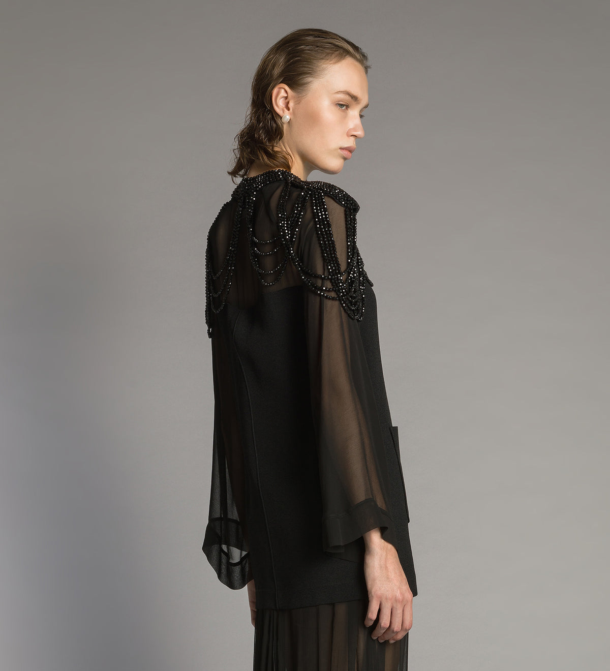 cape with hand-embroidered “black diamond” pearls black diamond